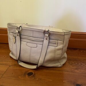 Tan leather bag with pink lining